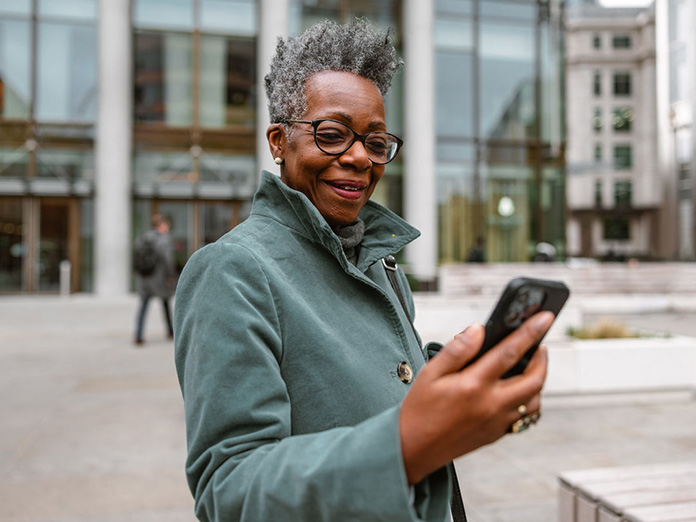 a woman on her cellphone asking a nurse her Medical questions and finding answers
